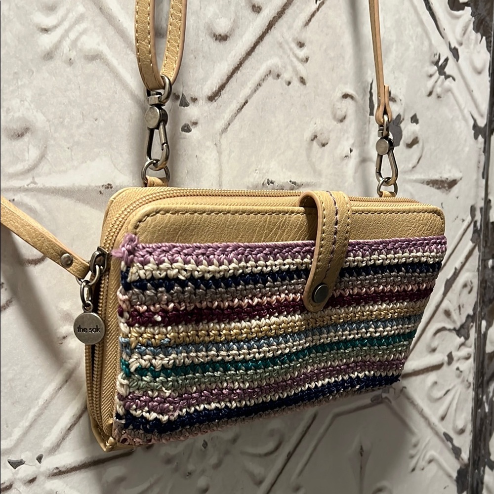 The Sak Tan Clutch with Braided Trim and Zipper Closure